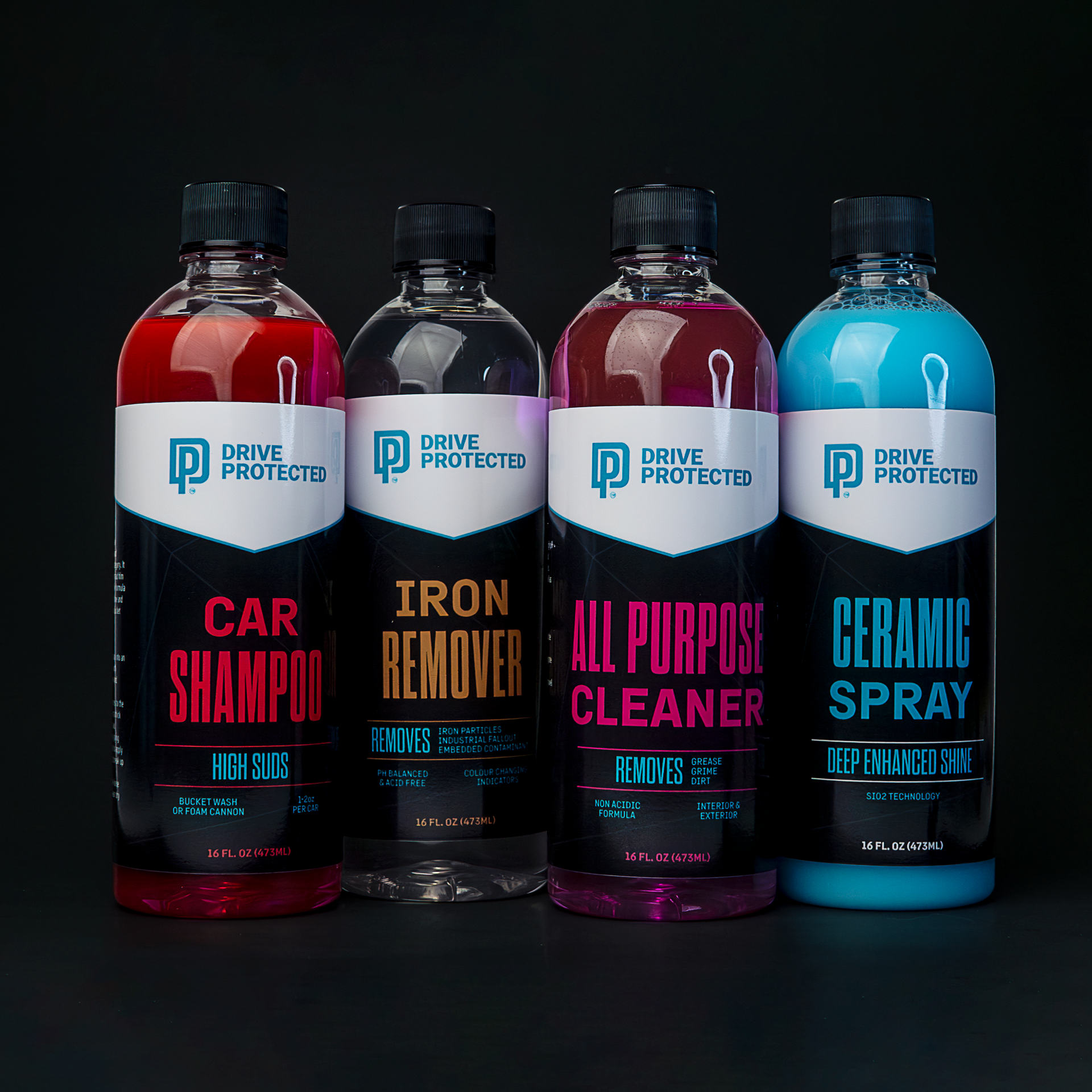 Four bottles of Drive Protected car care products on a black background